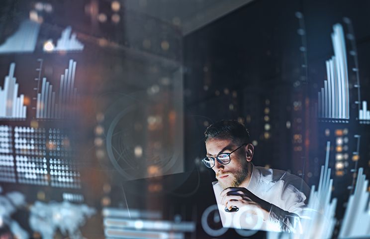 man working behind a computer